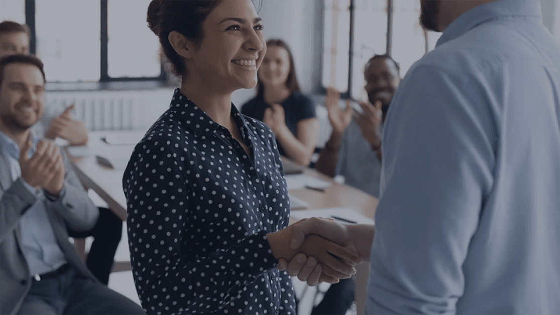 boss shaking hands with his employee