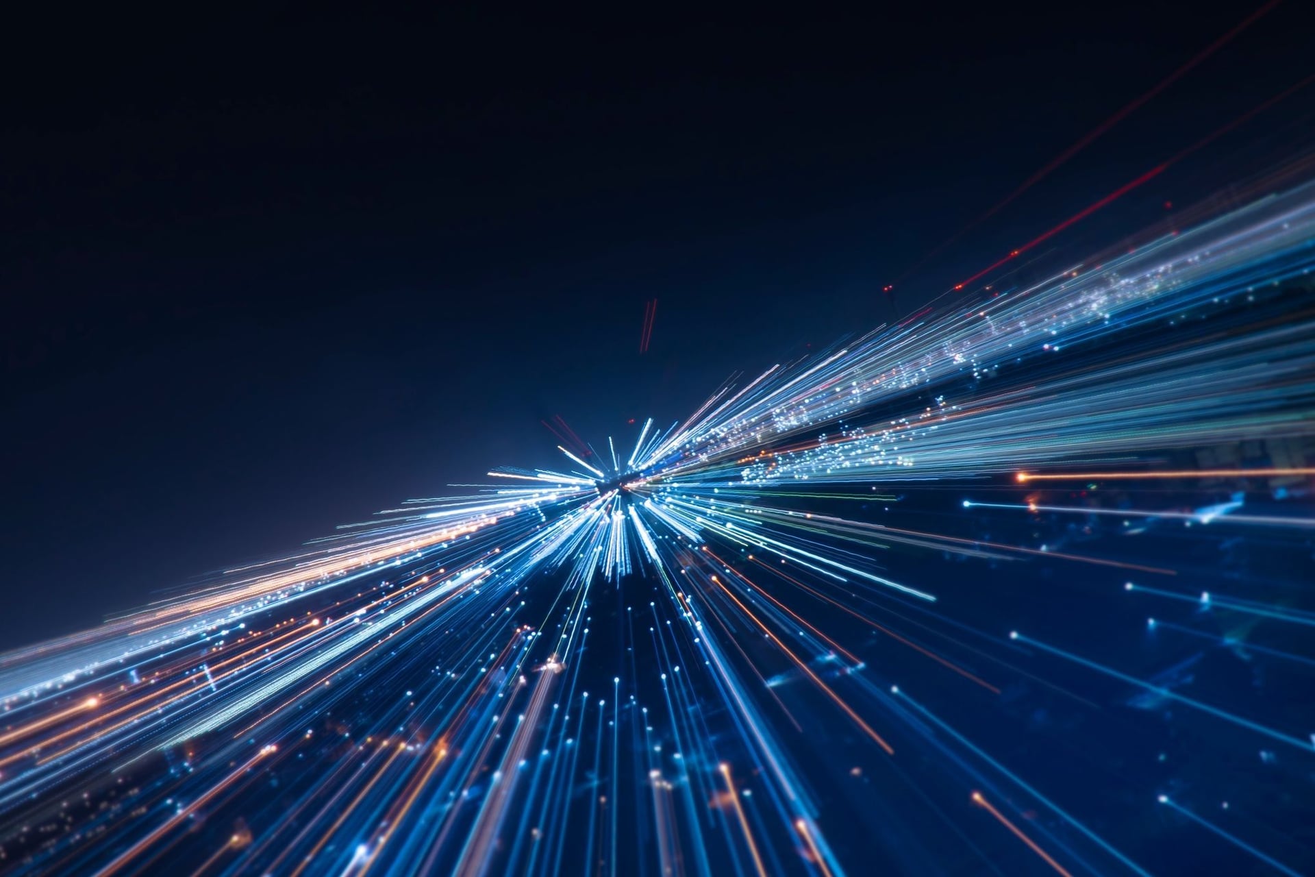 Neon blue light streaks representing high-speed data processing for predictive modeling in AI-driven risk assessment.