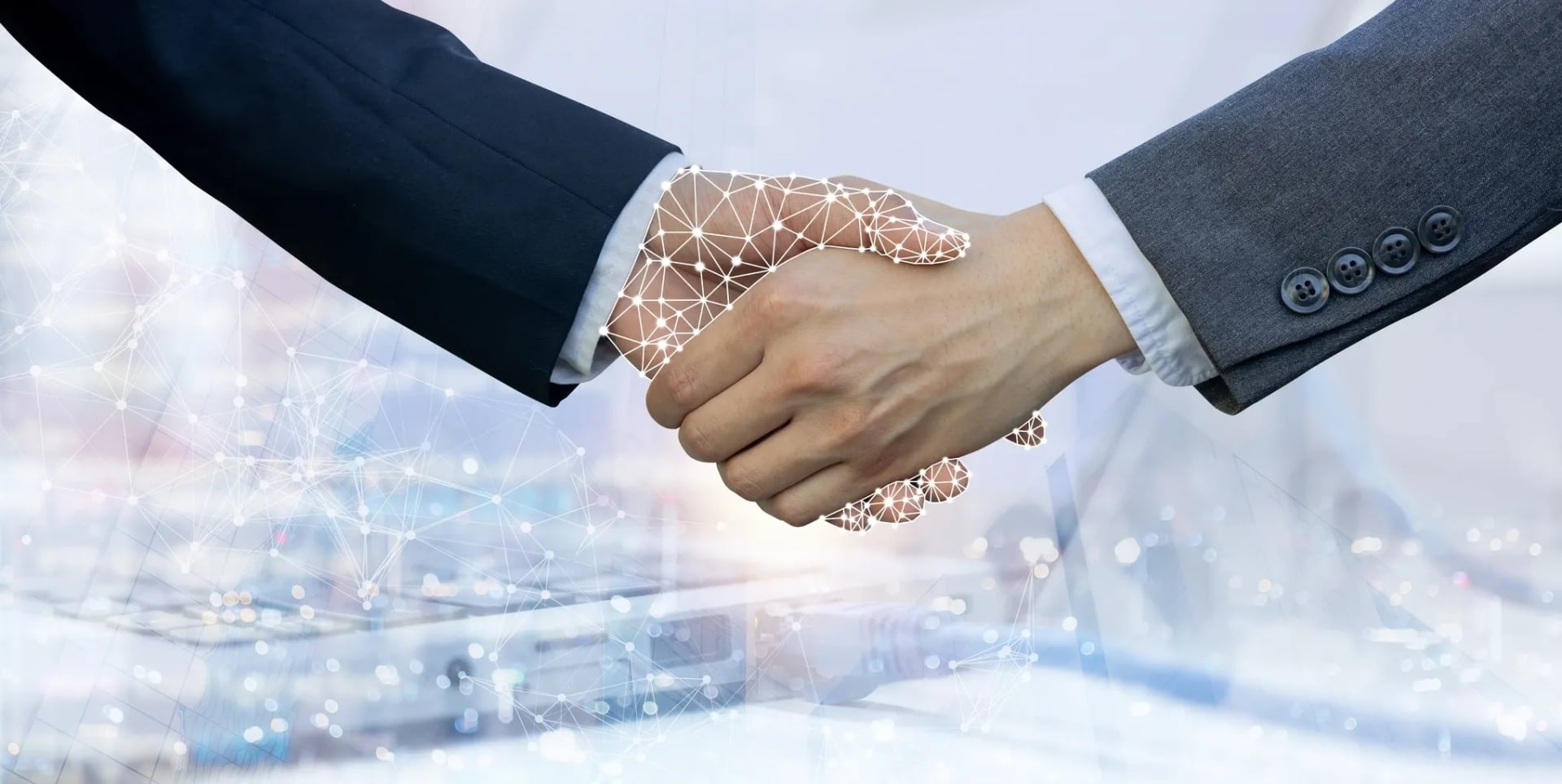 A close-up of a handshake between two people in business attire, with one hand featuring a glowing white digital wireframe overlay, symbolizing an artificial intelligence or modern technology partnership.