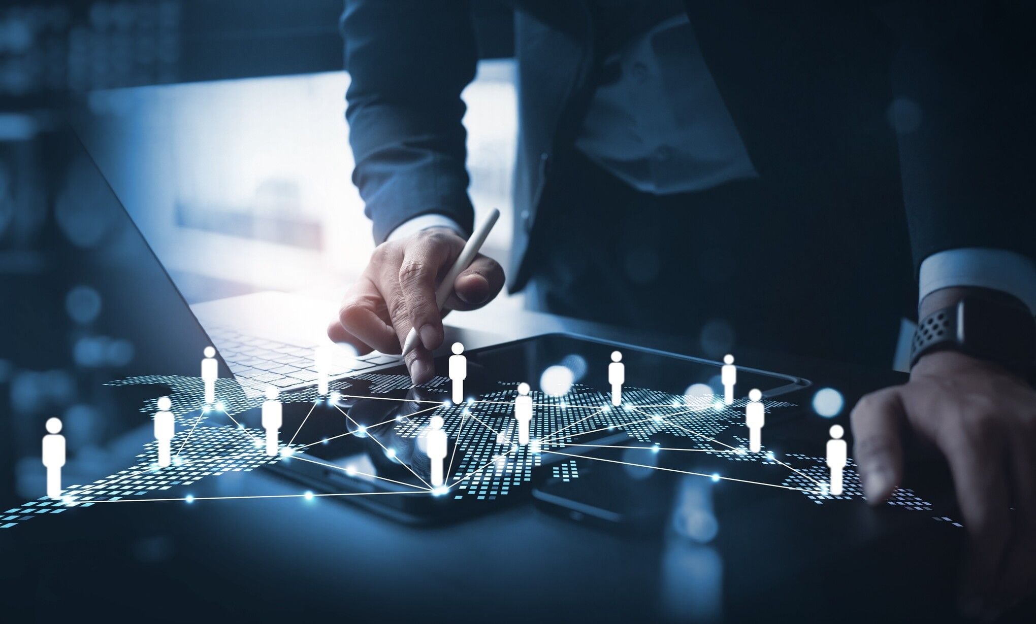 A professional using a tablet to manage a glowing digital world map, representing the global connectivity and talent pool of nearshore outsourcing